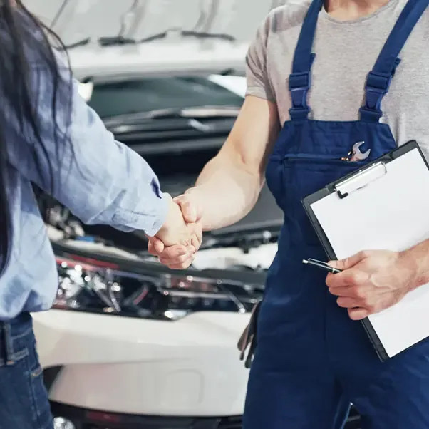 Technician shaking hands with a customer