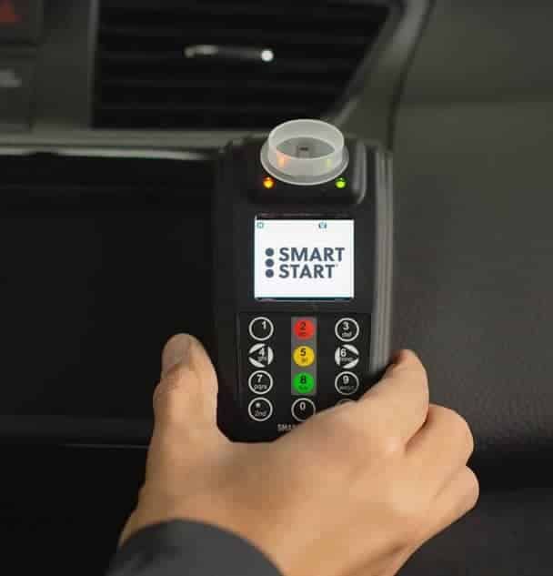Smart Start interlock handset held in a car