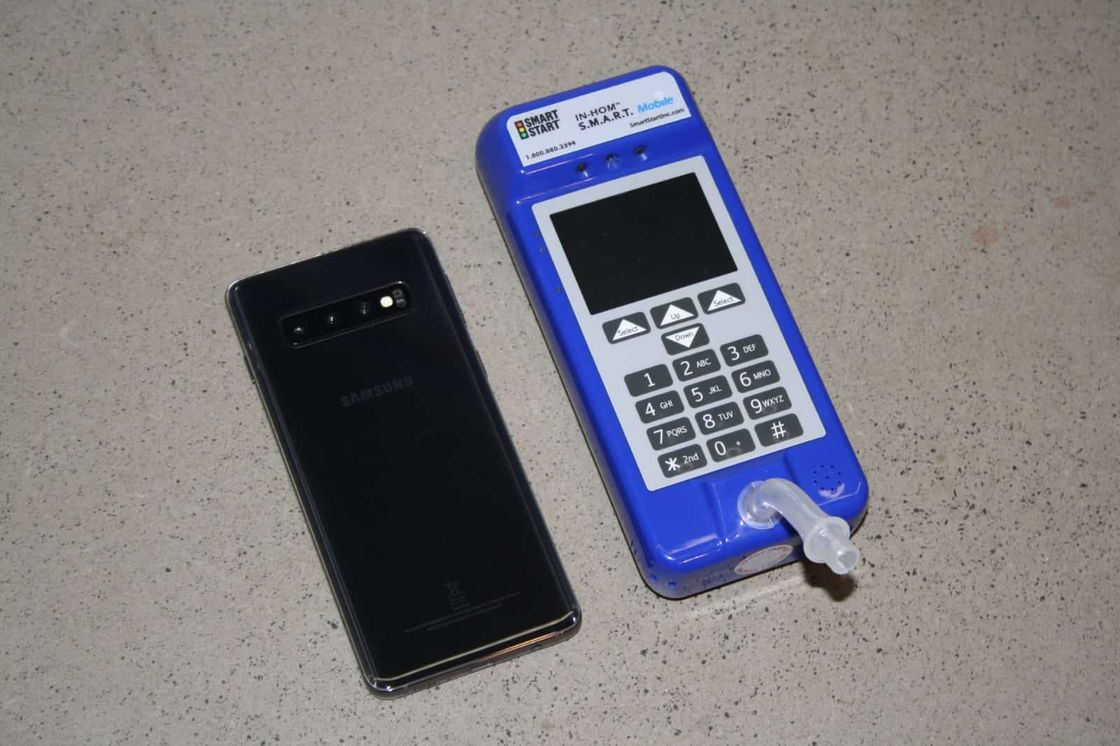 Smart Mobile device beside a smartphone for size