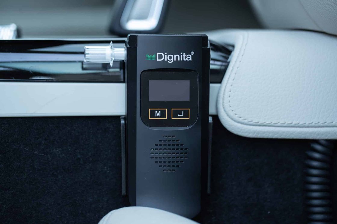 Dignita voluntary interlock handset mounted in a car