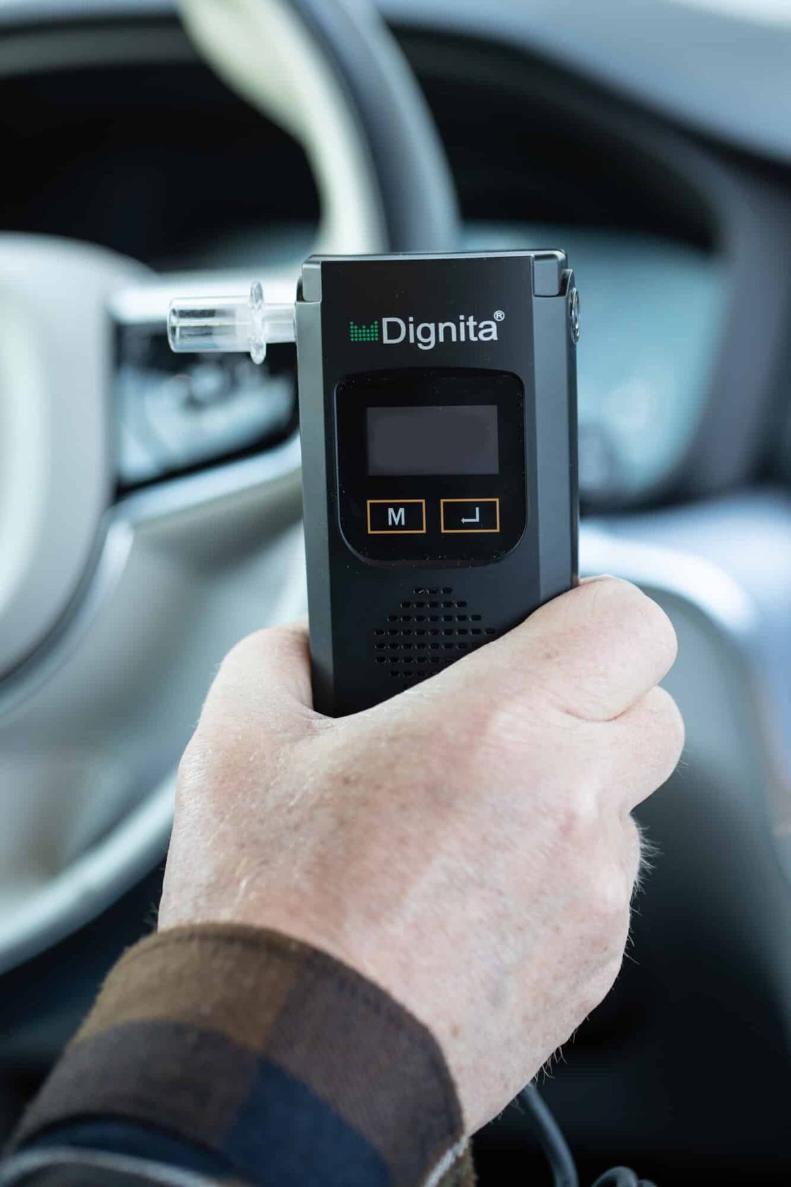 Driver holding a Dignita interlock handset